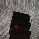 Bild 2: Unzählige Sternspuren über dem Feuerwachturm bei Wolfgarten im Nationalpark Eifel.